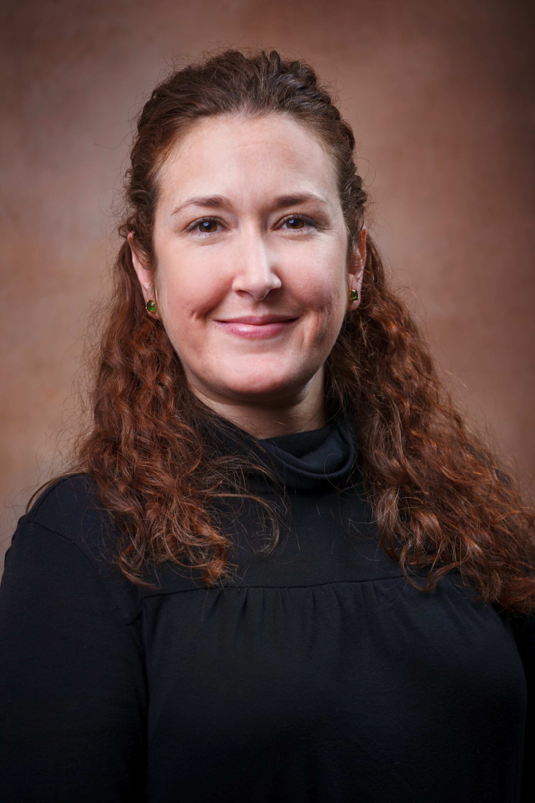 headshot of Kelly Thames in a black dress